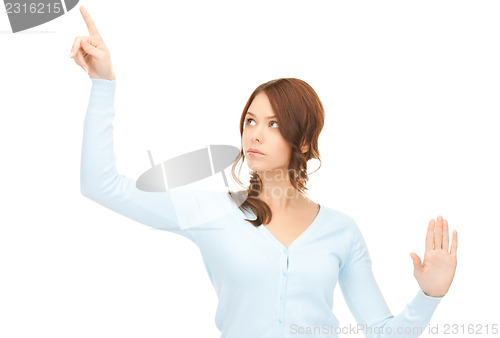 Image of businesswoman working with something imaginary
