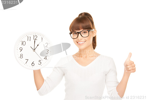 Image of woman holding big clock