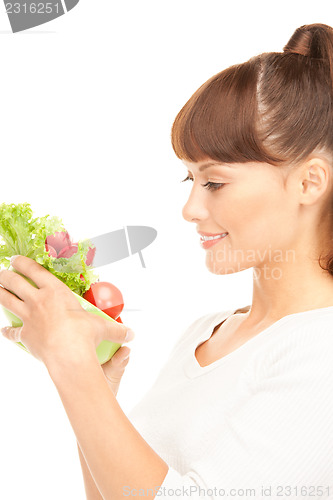 Image of beautiful housewife with vegetables