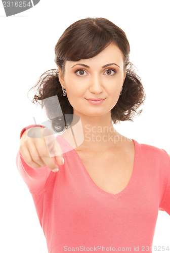 Image of attractive businesswoman pointing her finger