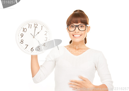 Image of woman holding big clock