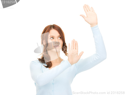 Image of businesswoman working with something imaginary