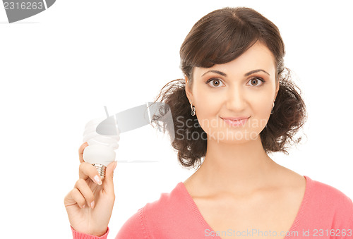 Image of woman holding energy saving bulb