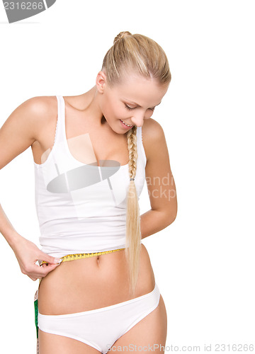 Image of beautiful woman with measure tape