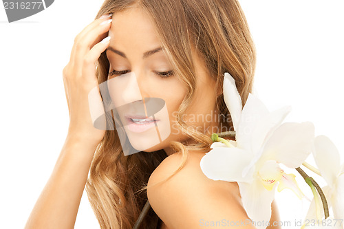 Image of beautiful woman with white flower