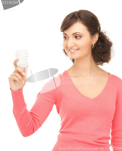 Image of woman holding energy saving bulb