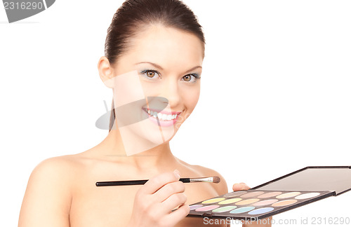 Image of lovely woman with palette and brush