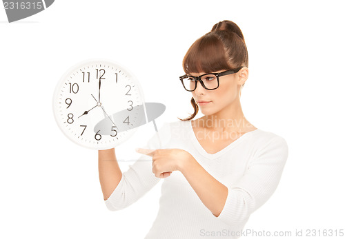 Image of woman holding big clock