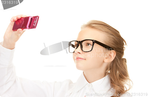 Image of happy girl taking picture with cell phone