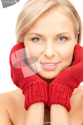 Image of beautiful woman in red mittens 