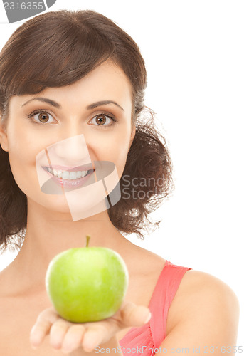 Image of young beautiful woman with green apple