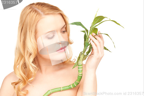 Image of woman with sprout over white