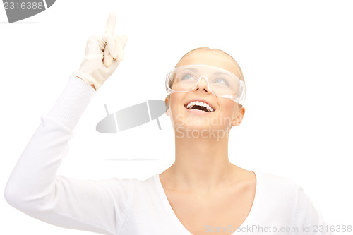 Image of woman in protective glasses and gloves