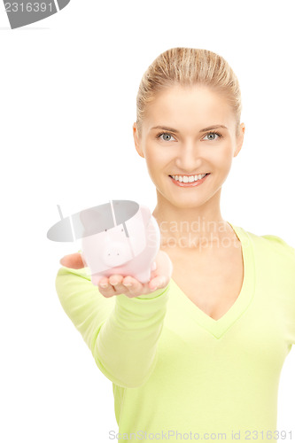 Image of woman with piggy bank