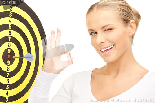 Image of businesswoman with dart and target