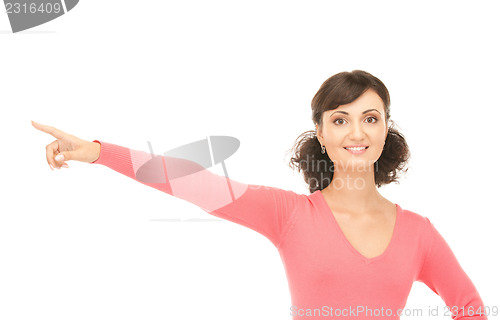 Image of attractive businesswoman pointing her finger