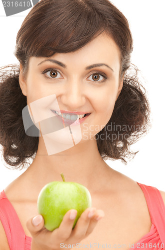 Image of young beautiful woman with green apple