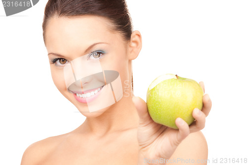 Image of young beautiful woman with green apple