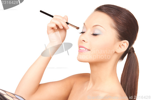 Image of lovely woman with palette and brush
