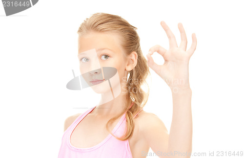 Image of lovely girl showing ok sign