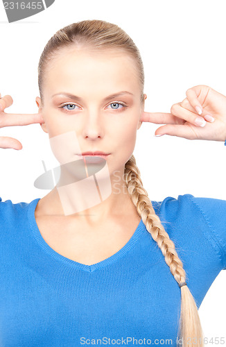 Image of woman with fingers in ears