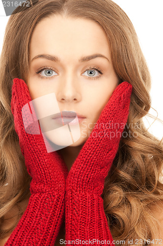 Image of beautiful woman in red mittens 