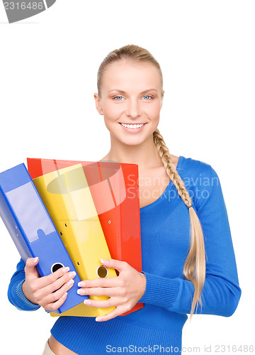 Image of young attractive businesswoman with folders