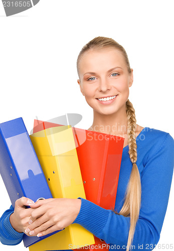 Image of young attractive businesswoman with folders