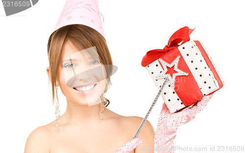 Image of teenage party girl with magic wand and gift box