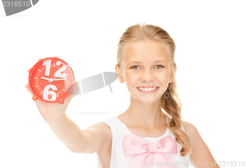 Image of girl holding alarm clock