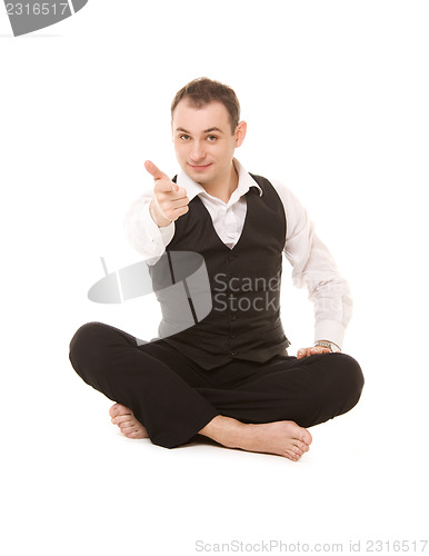 Image of businessman sitting in lotus pose