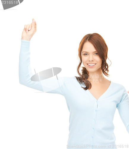 Image of businesswoman working with something imaginary