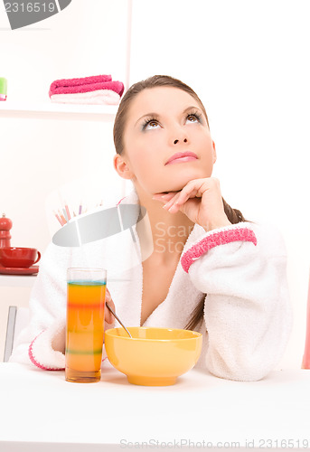 Image of woman eating her breakfast
