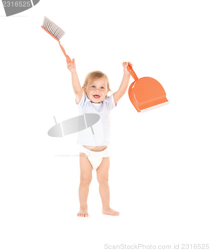 Image of baby boy with with dustpan and brush 