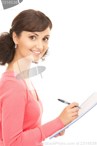 Image of young attractive businesswoman with notebook