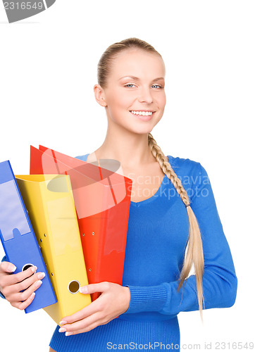 Image of young attractive businesswoman with folders