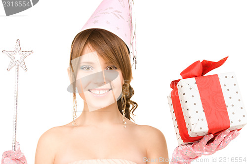 Image of teenage party girl with magic wand and gift box