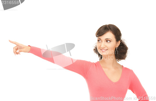 Image of attractive businesswoman pointing her finger