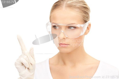 Image of woman in protective glasses and gloves