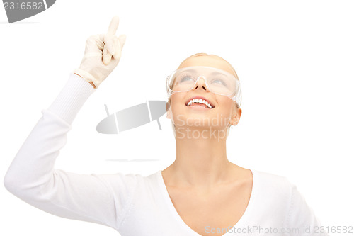 Image of woman in protective glasses and gloves