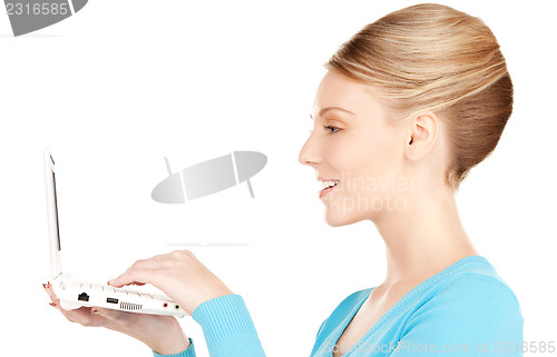 Image of happy woman with laptop computer