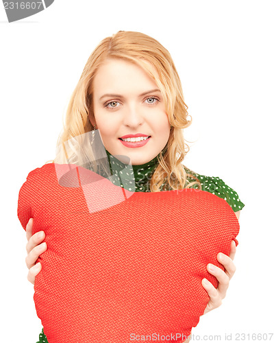 Image of woman with red heart-shaped pillow