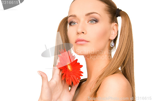 Image of woman with red flower