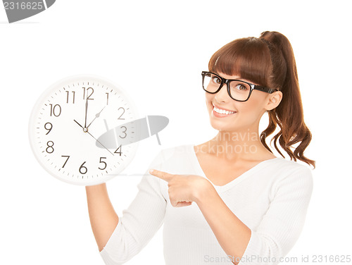 Image of woman holding big clock