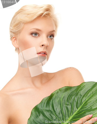 Image of woman with green leaf