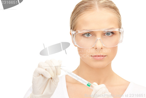 Image of attractive female doctor with thermometer