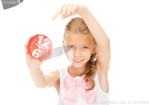 Image of girl holding alarm clock