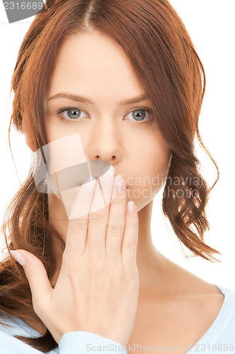 Image of hand over mouth