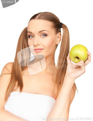 Image of young beautiful woman with green apple