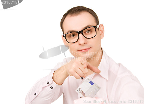 Image of businessman with piggy bank and money